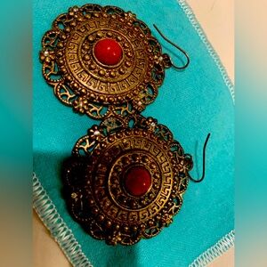 Rare and unique fashionable goldfish round earrings with orange stones.Must have